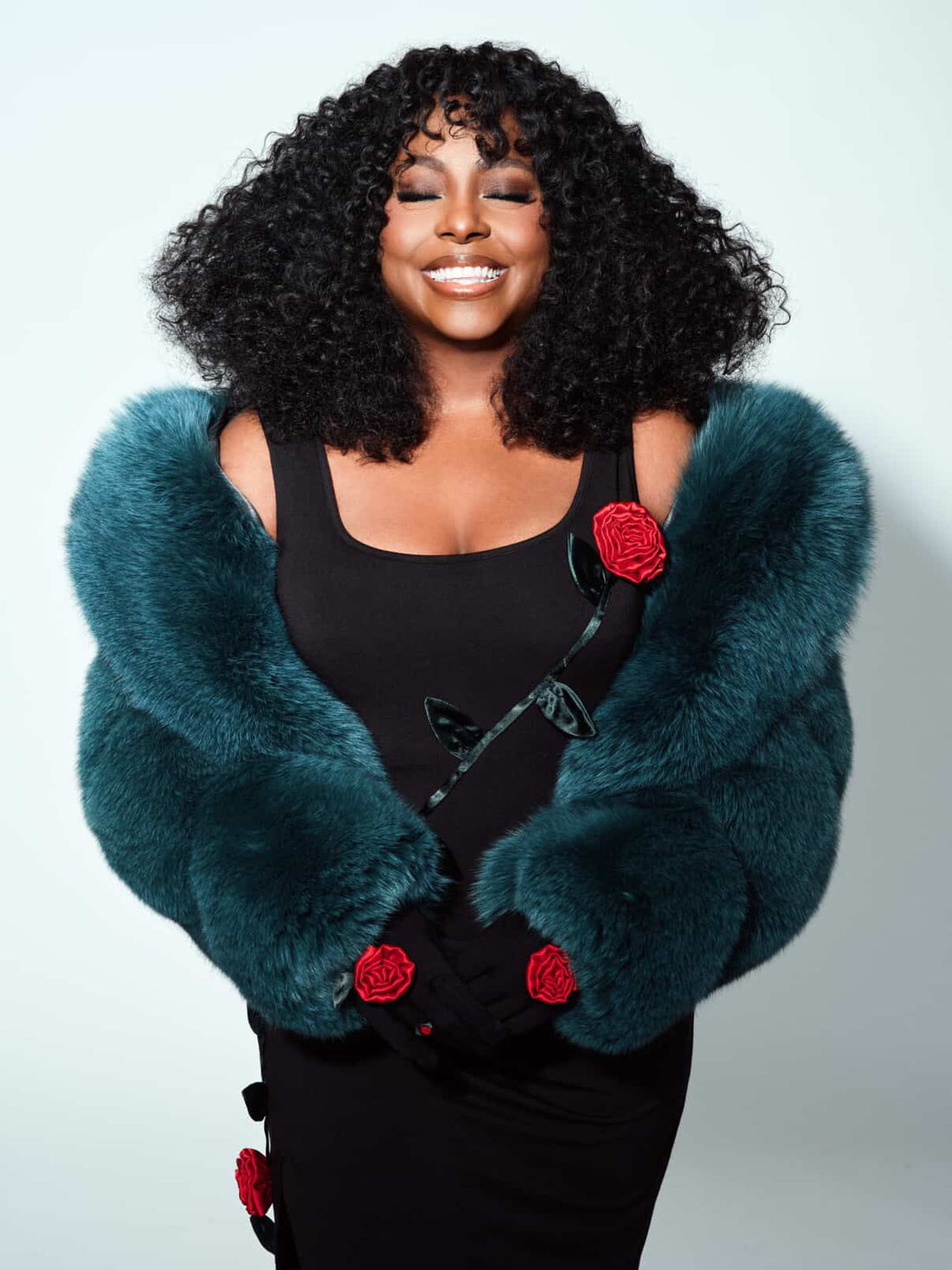 Ledisi in FGM Bespoke teal fox fur stole with red rose accents for Vogue